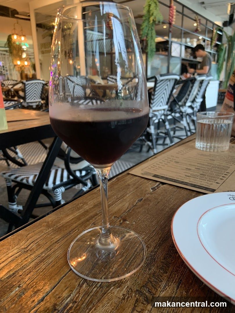 Table setting with wine and menu