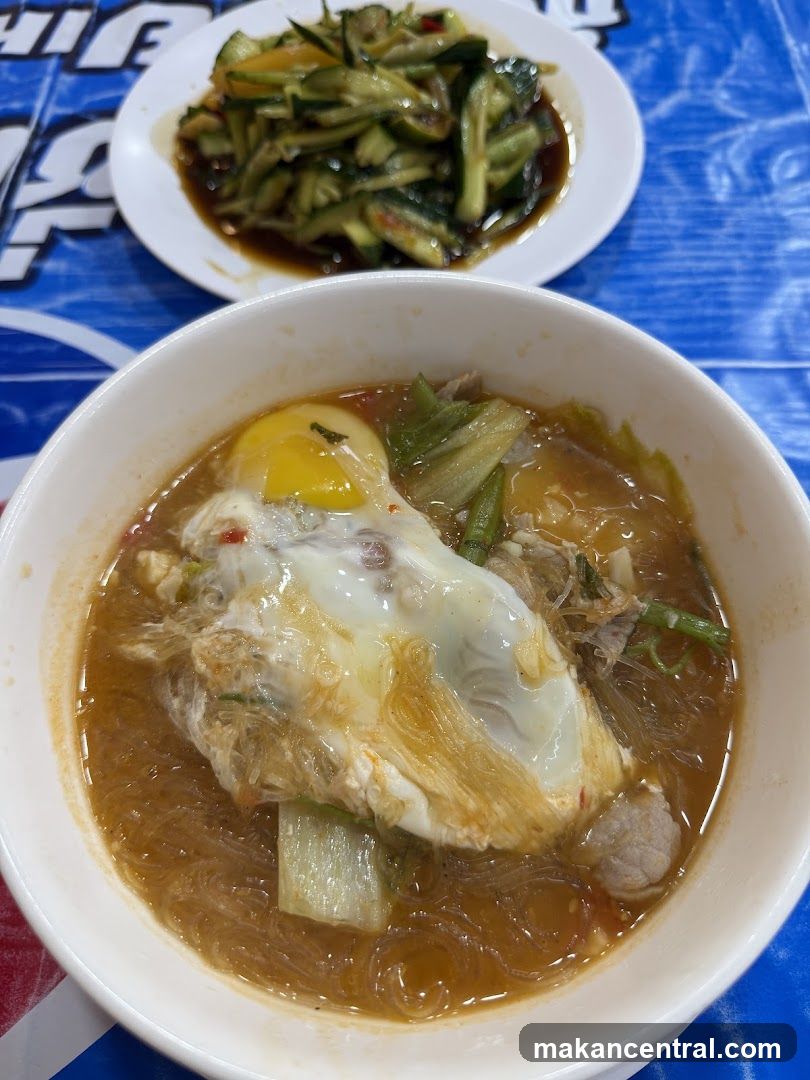 Noodle Soup with Fried Egg and Cucumber Salad