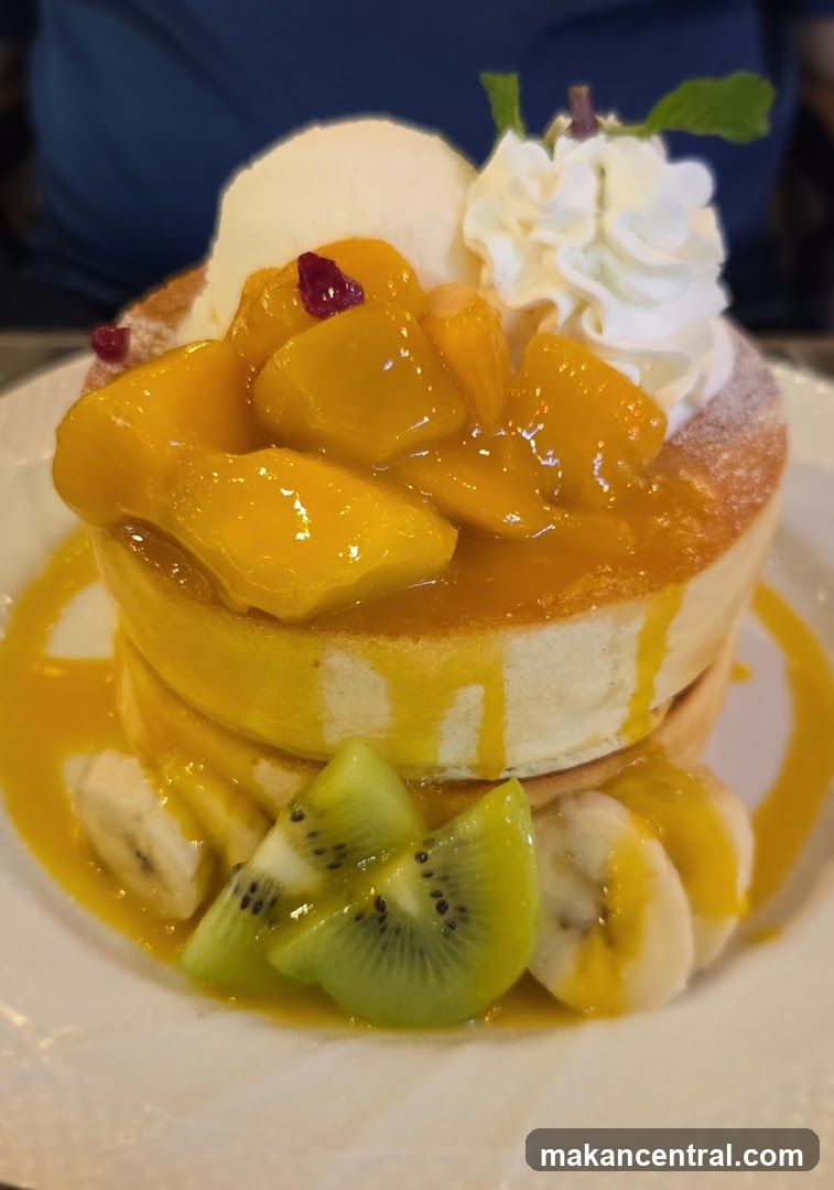 Fluffy pancakes with mango and fruit