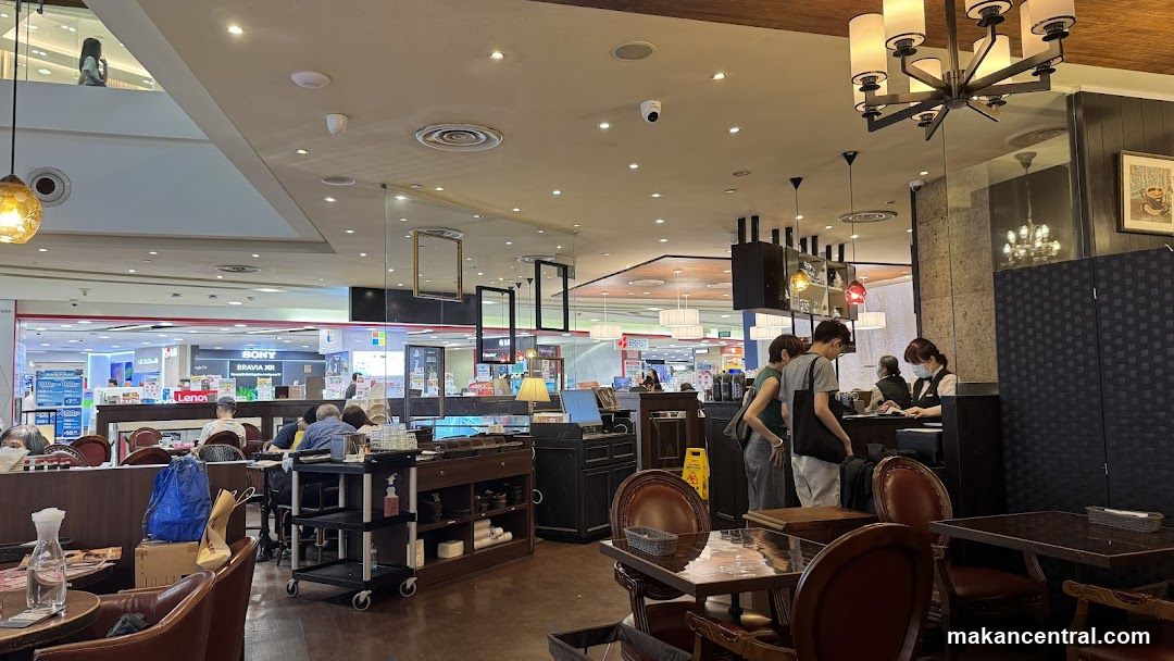 Interior of a cafe with customers and staff