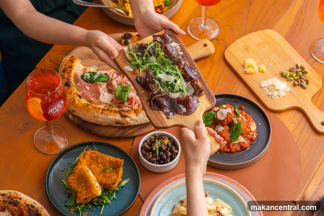 Table with various Italian dishes and drinks
