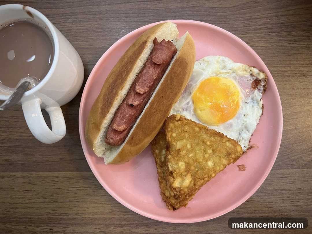 Breakfast Plate with Hot Dog, Fried Egg, and Hash Browns