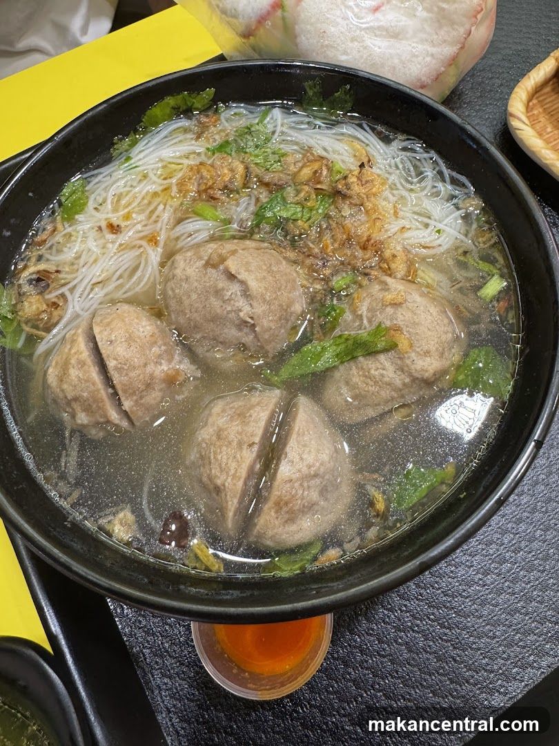 Bowl of Noodle Soup with Meatballs
