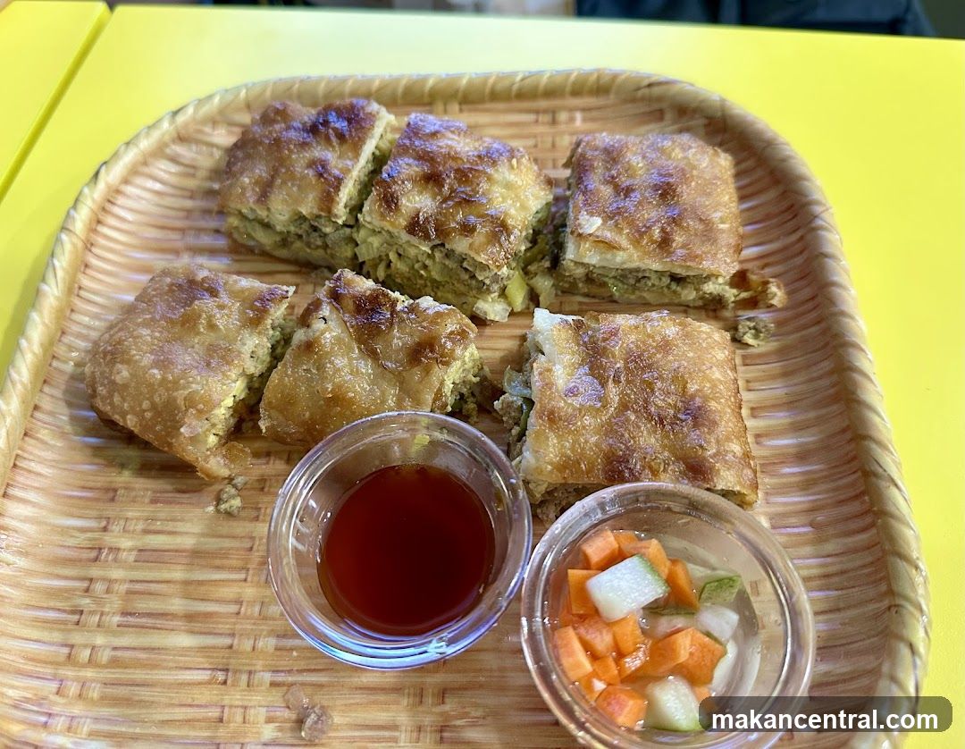 Savory Pastries with Dipping Sauce and Pickles