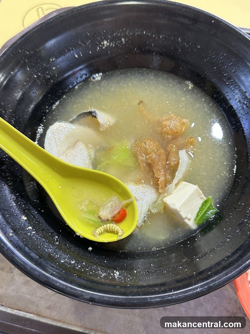 Bowl of Soup with Fish and Tofu