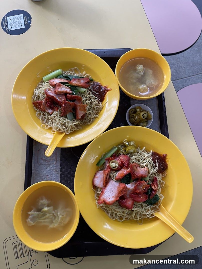 Two bowls of noodles with char siu