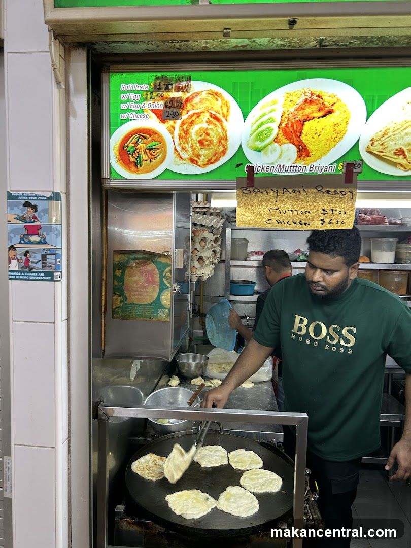 Food Stall with Cook Preparing Roti Prata