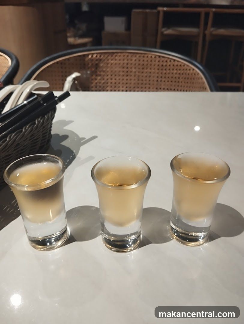 Three shot glasses of amber liquid