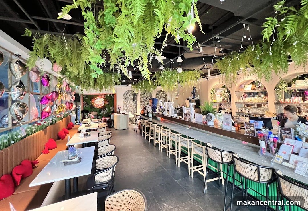 Restaurant Interior with Lush Greenery and Seating