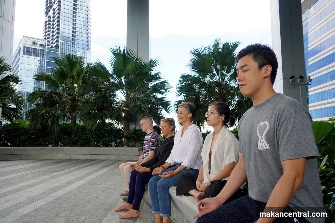 People meditating outdoors