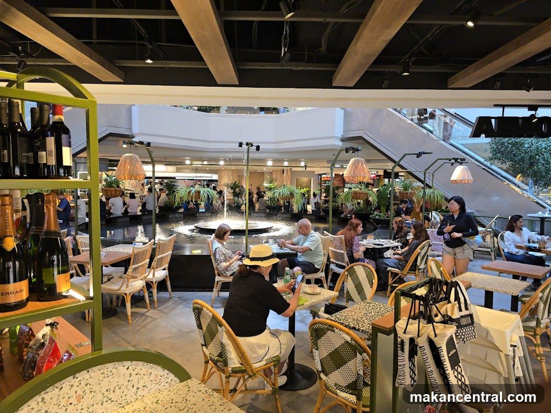 Indoor cafe with fountain and shoppers