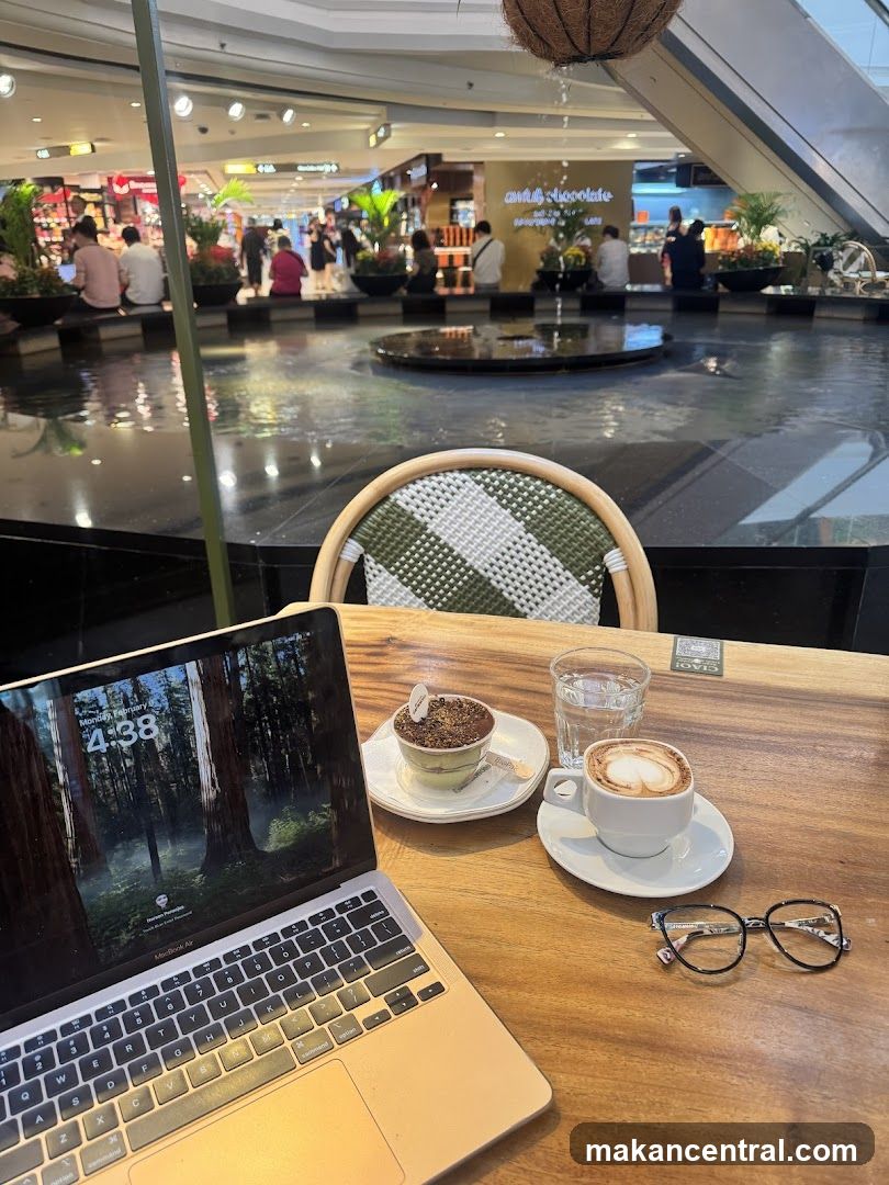 Cafe table with laptop and coffee