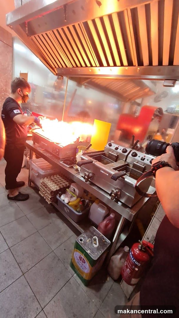 Chef cooking with flames