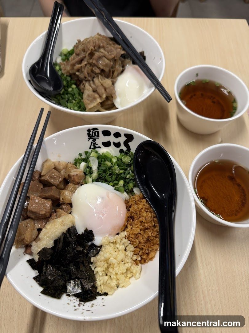Two bowls of Japanese rice bowls with toppings