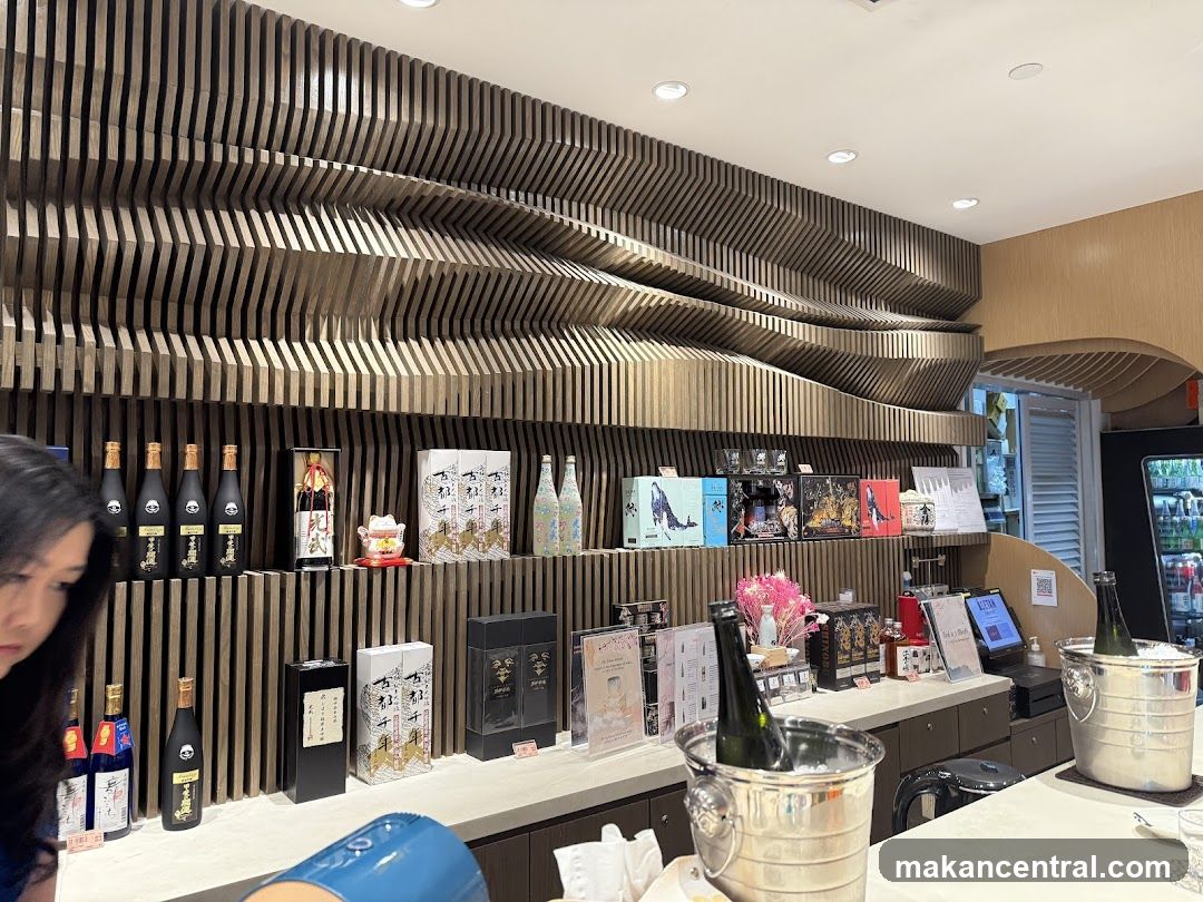 Sake bottles and gift boxes on display