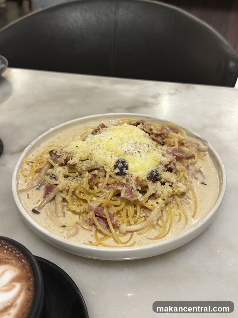 Spaghetti Carbonara with a side of coffee