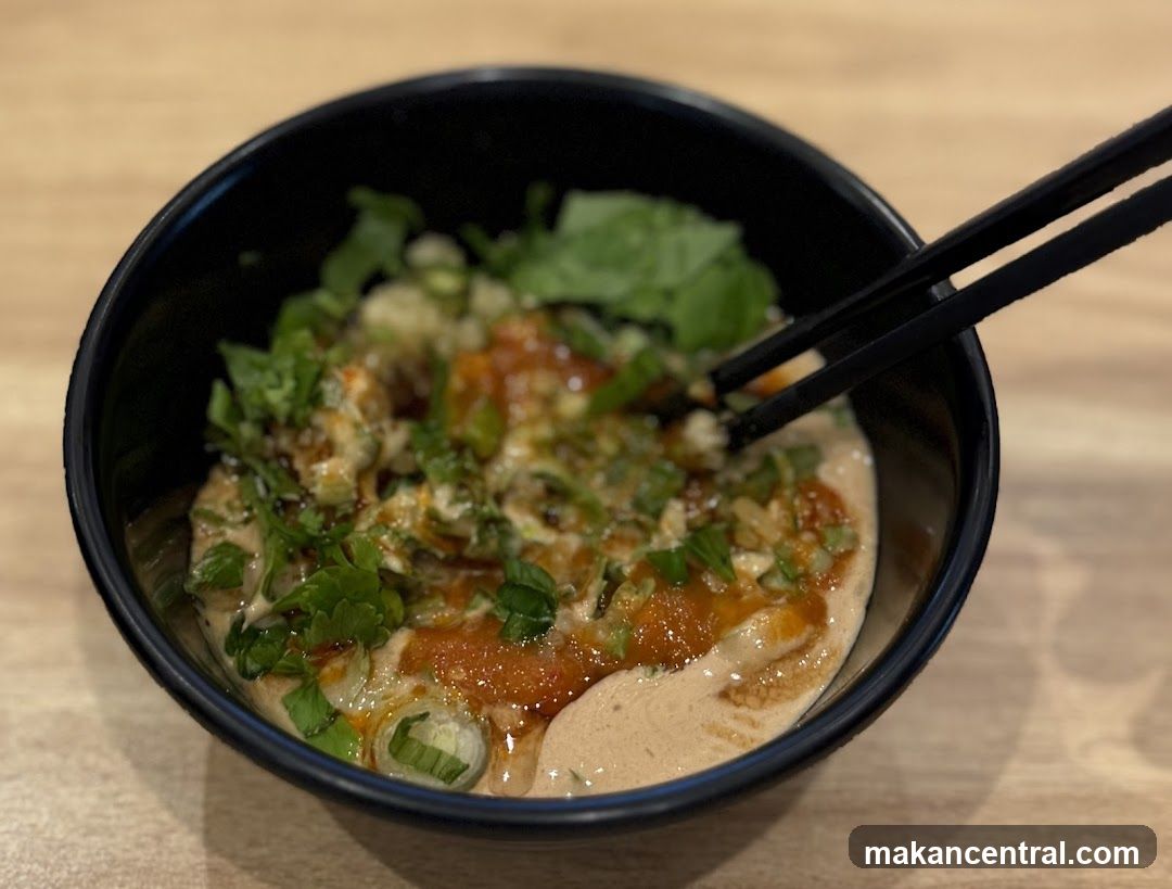 Bowl of food with chopsticks