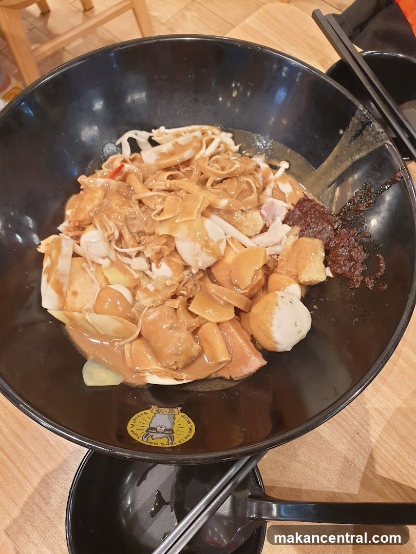 Bowl of noodles with sauce and toppings