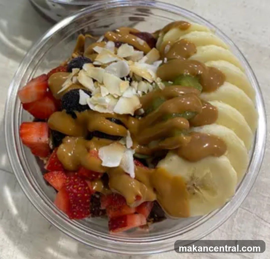 Fruit bowl with peanut butter and coconut flakes