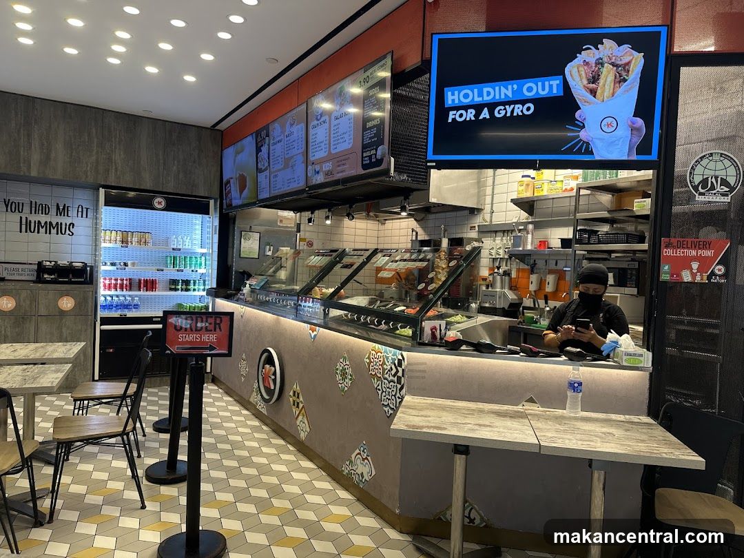 Restaurant Interior with Gyro Advertisement