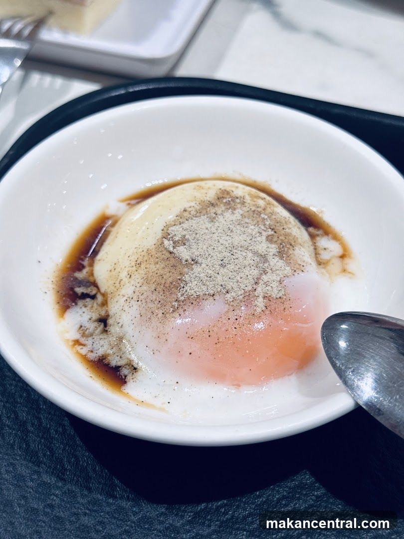 Soft-boiled egg with pepper and soy sauce
