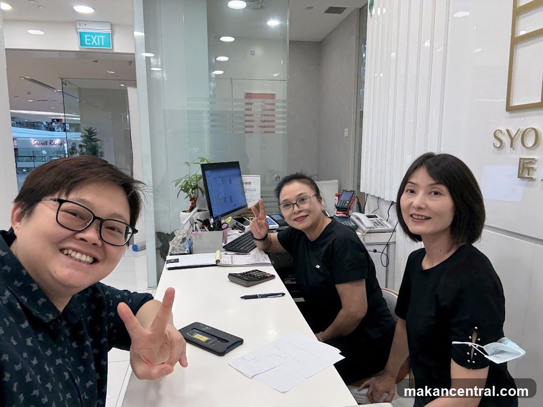 Three women at a reception desk