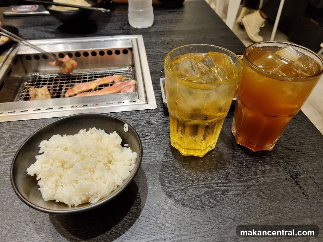 Grilling Meat with Rice and Drinks