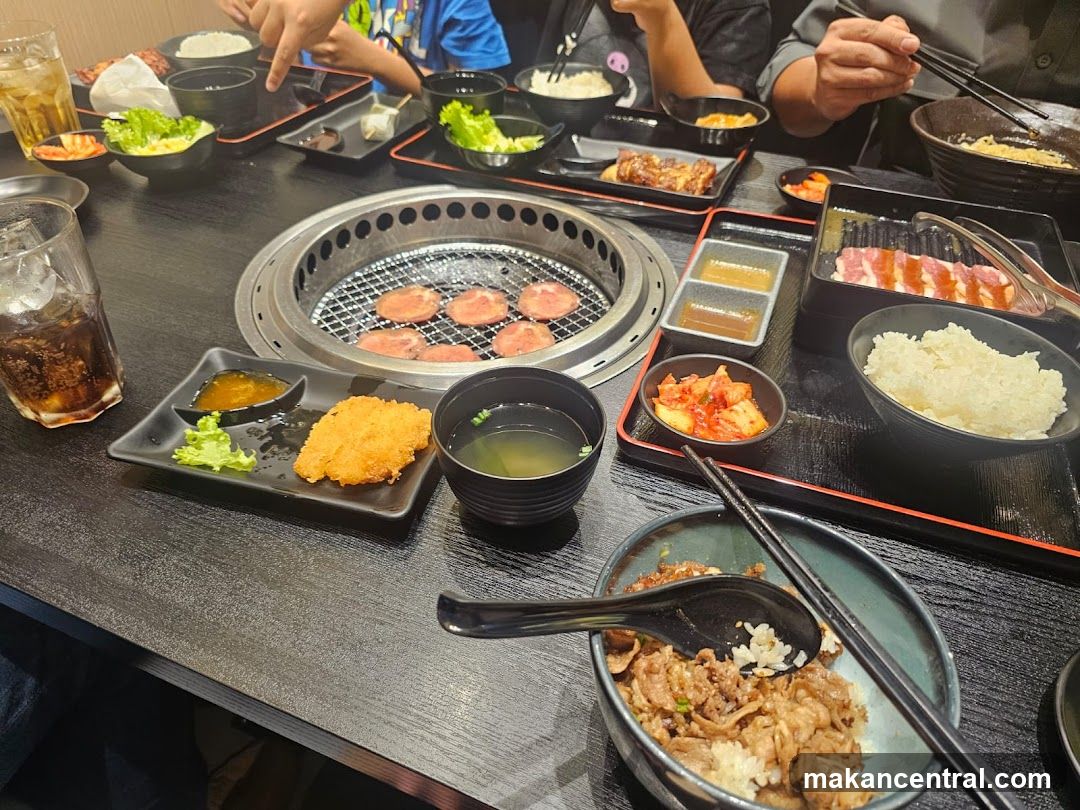 Table with grilled meat and side dishes