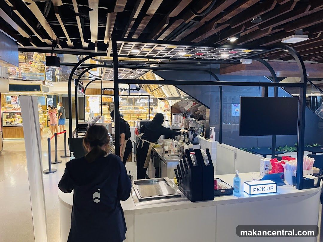 Cafe counter with staff and customers