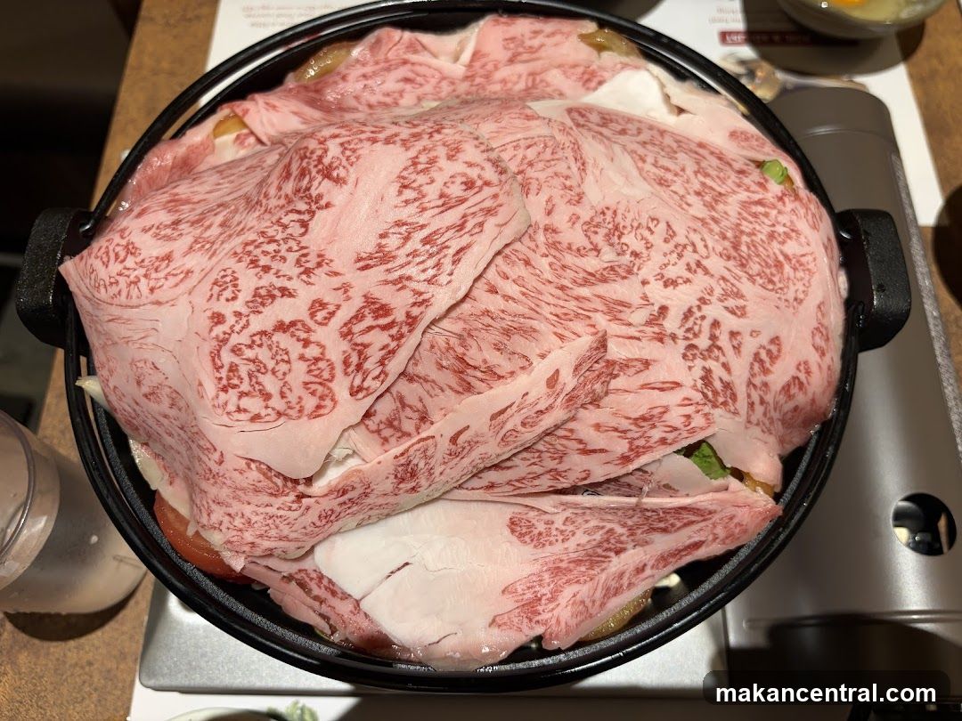 Close-up of thinly sliced marbled beef in a pot