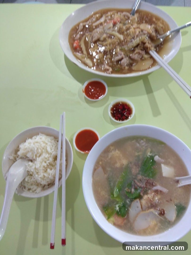 Two bowls of soup and a bowl of rice