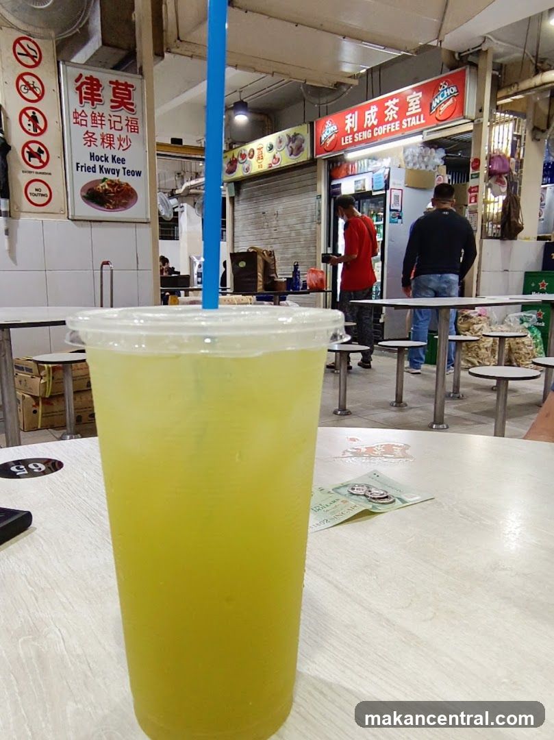 Sugarcane Drink with Singaporean Hawker Stall in Background