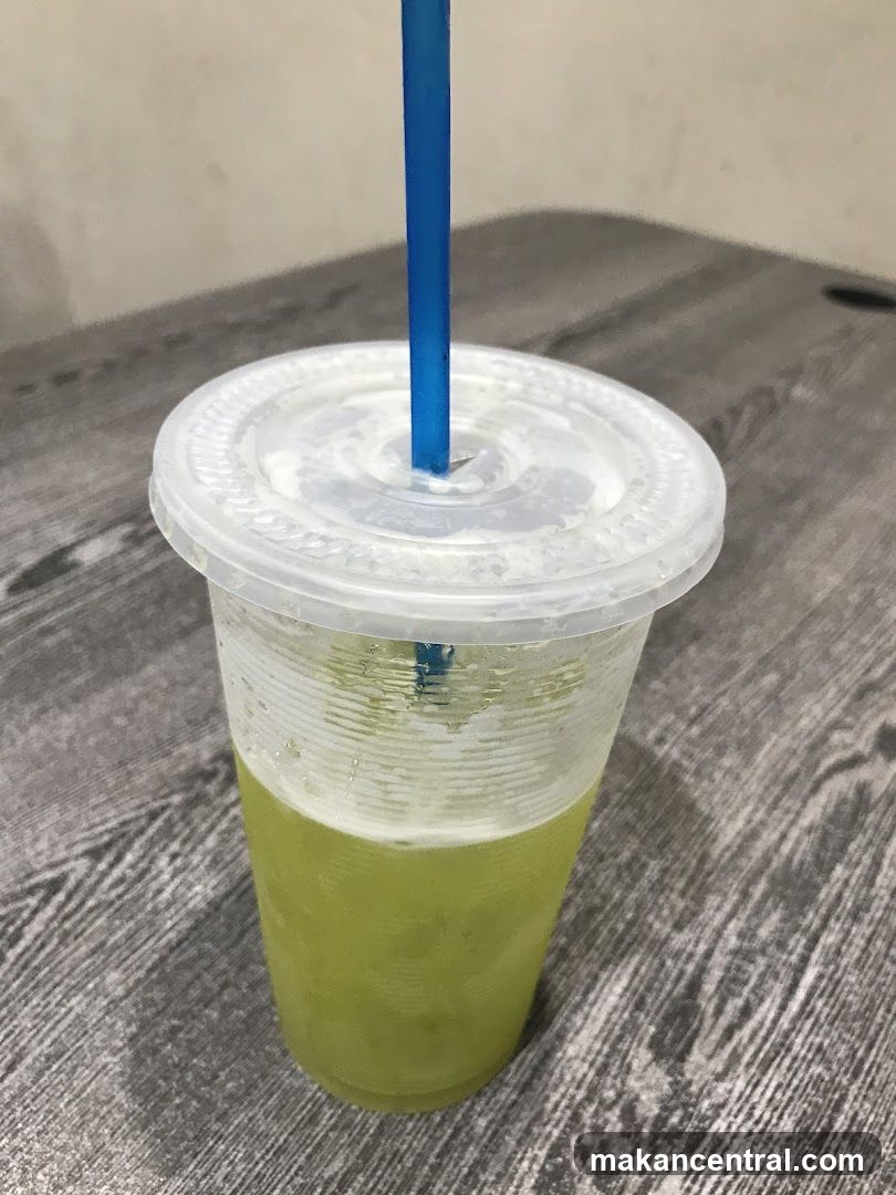Green Juice in a Plastic Cup