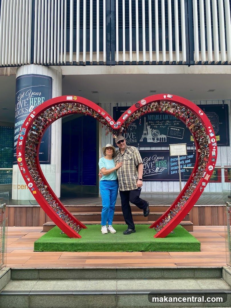 Couple Posing at a Love Lock Sculpture