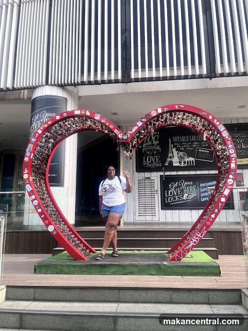 Woman Posing by Love Lock Sculpture