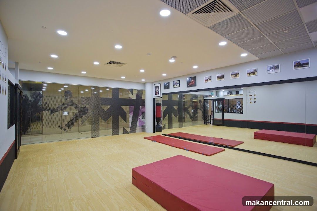 Gymnasium with training mats and mirrors