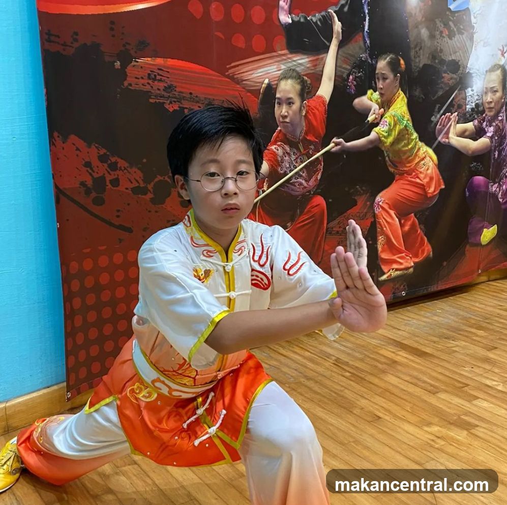 Young martial artist in uniform