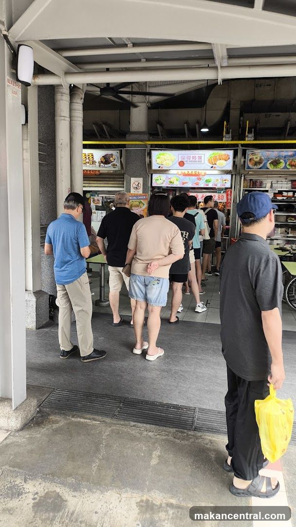 People queuing at a food stall