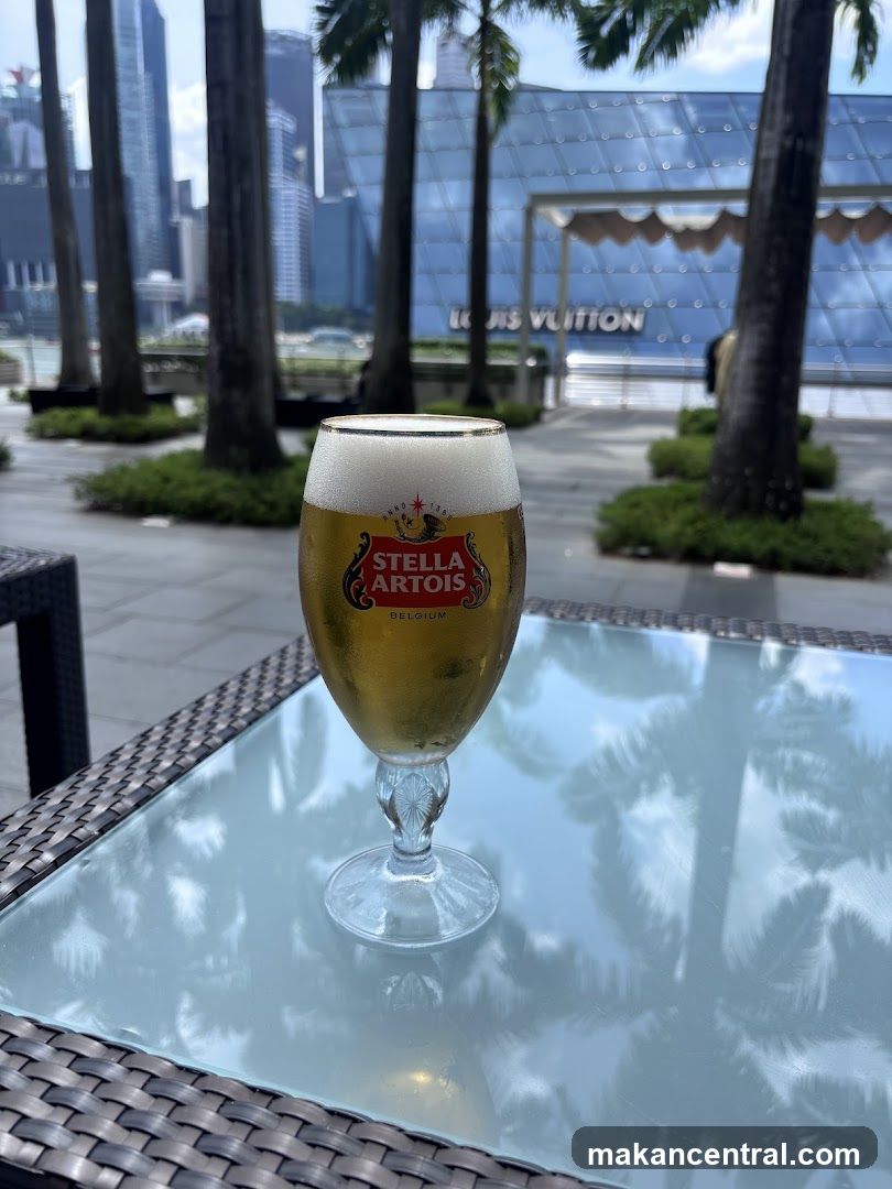 Beer on a table with a Louis Vuitton store in the background