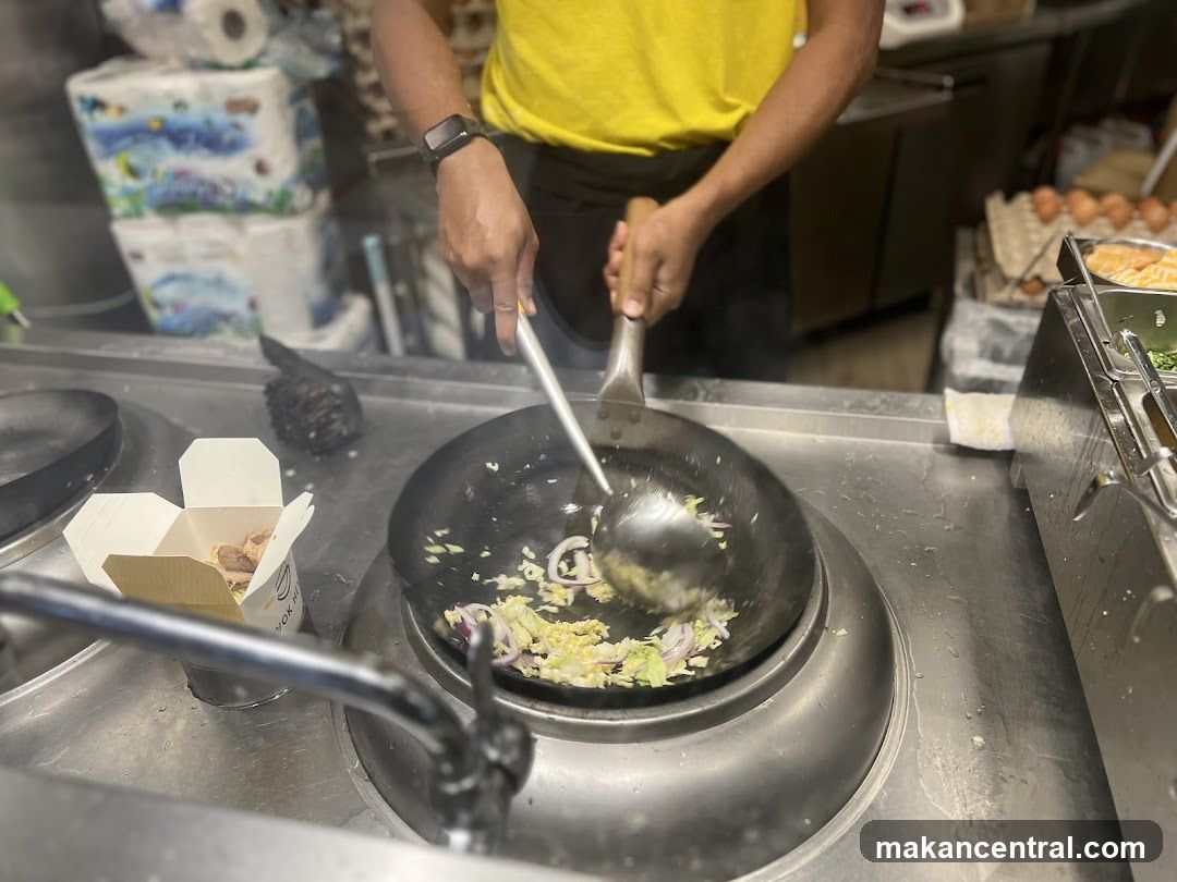 Chef cooking in a wok