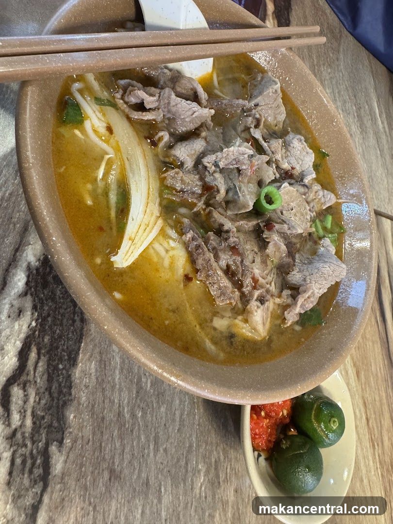 Beef noodle soup with chili and lime
