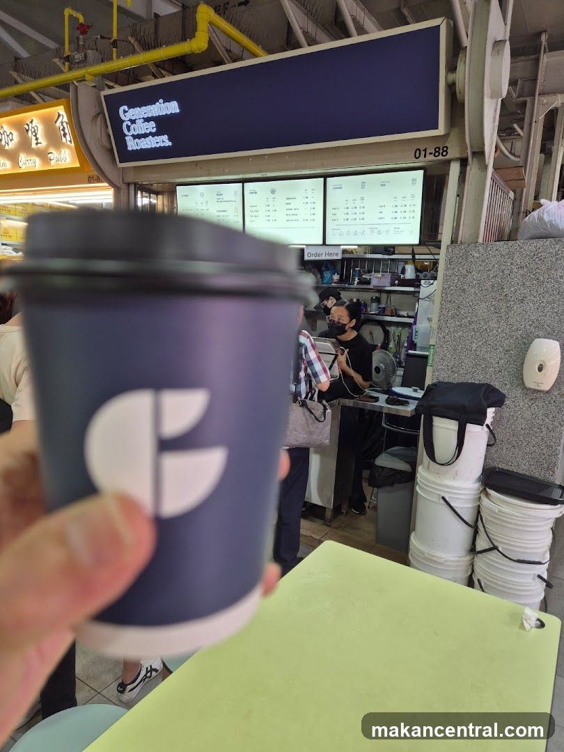 Coffee cup in front of a coffee shop