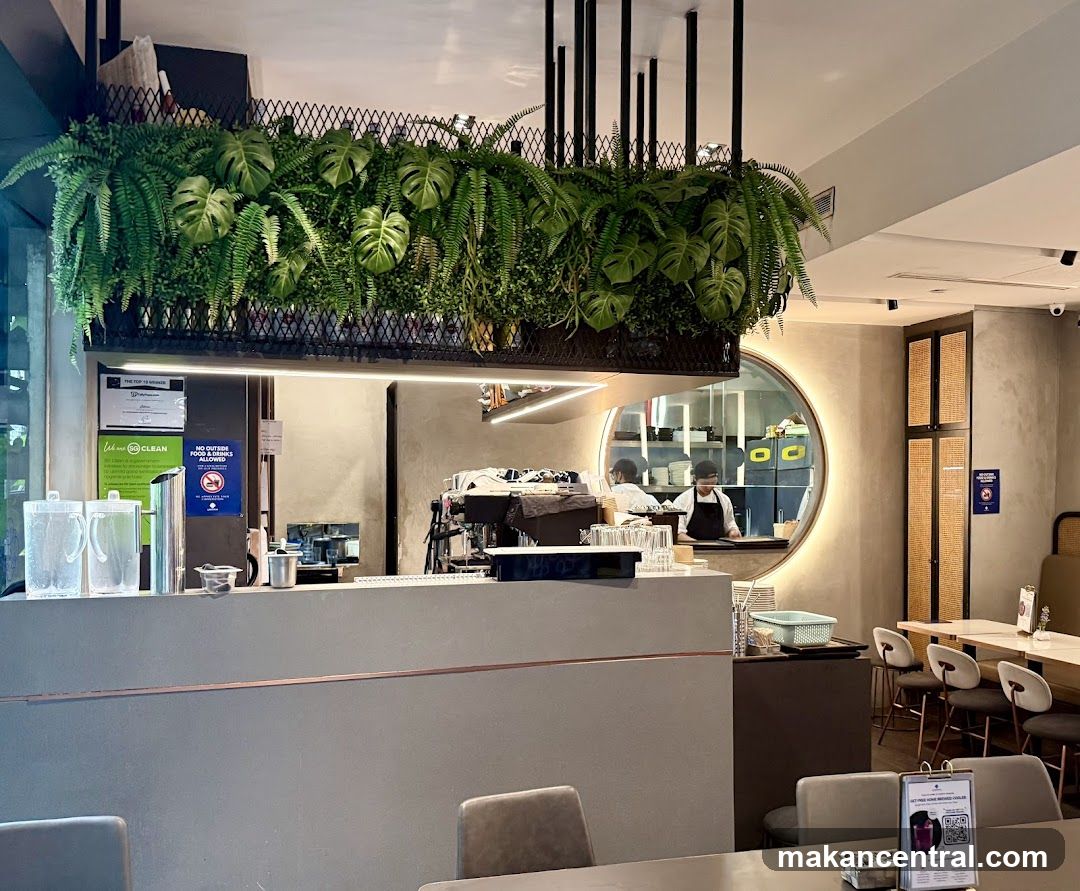 Cafe Interior with Greenery and Circular Mirror