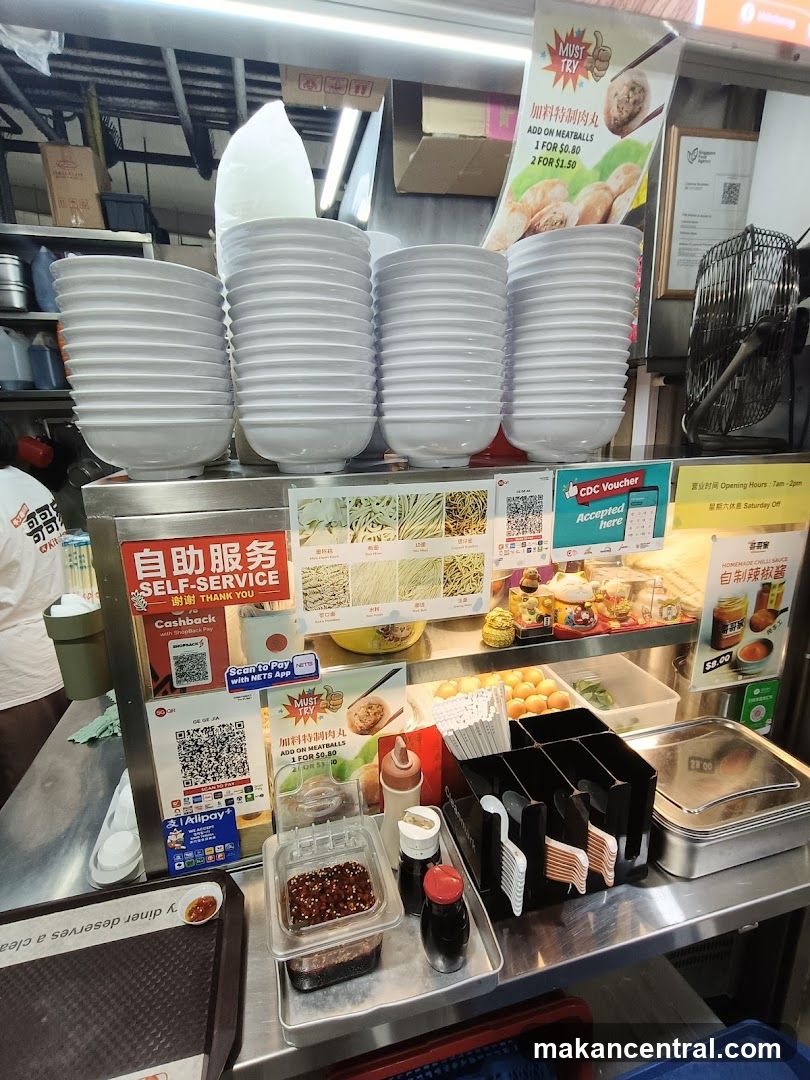 Food stall counter with bowls and condiments