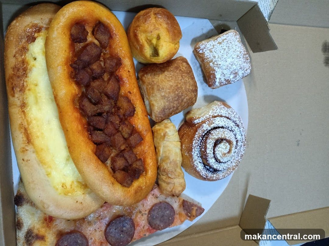Assorted Pastries and Pizza Slice