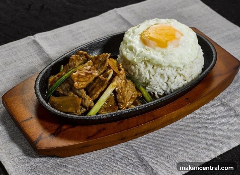 Sizzling Beef with Rice and Fried Egg