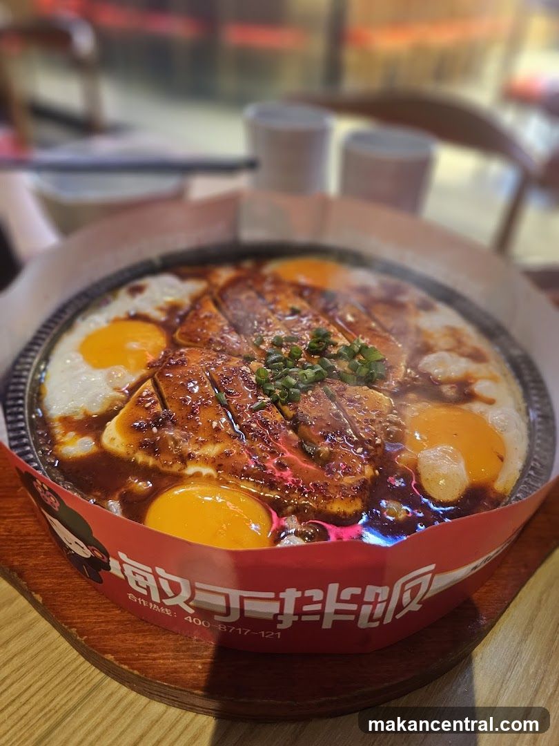Sizzling Dish with Eggs and Meat