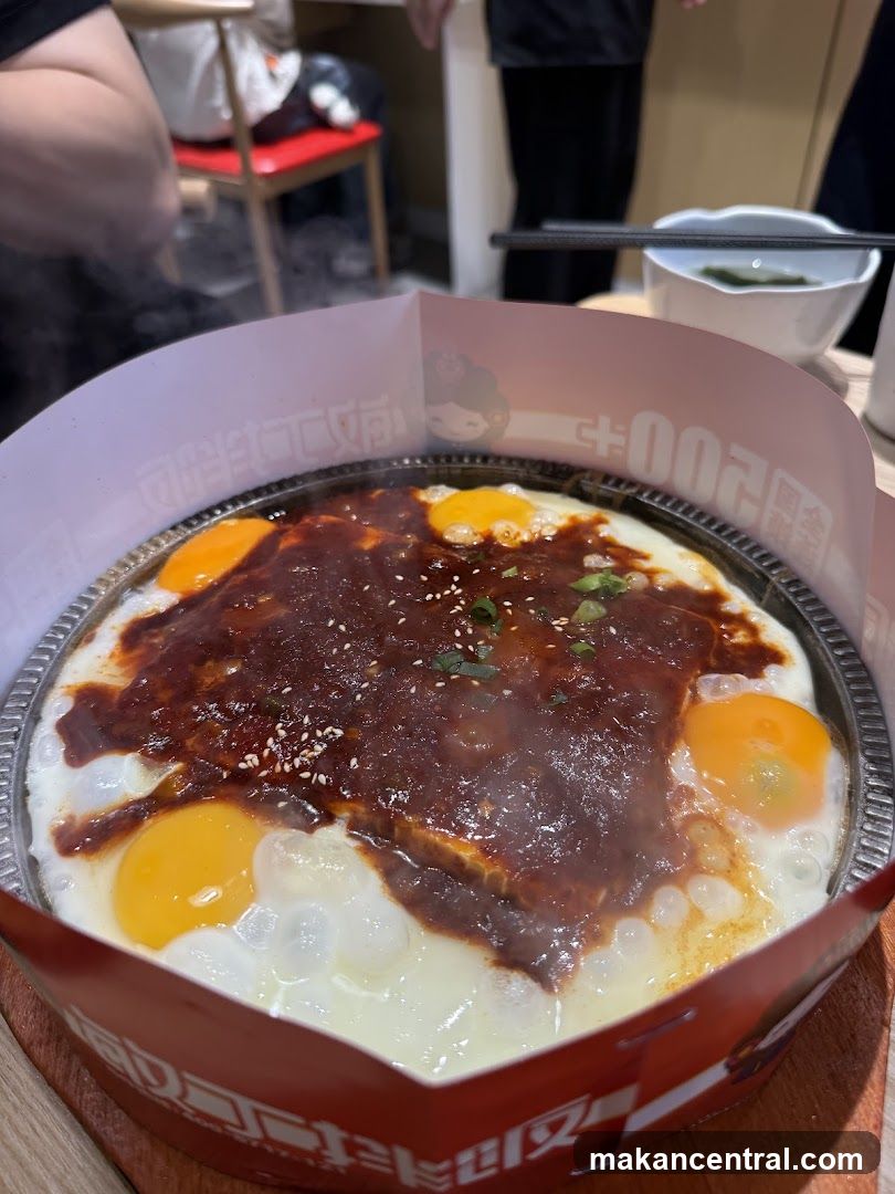 Steaming Hot Dish with Eggs and Sauce