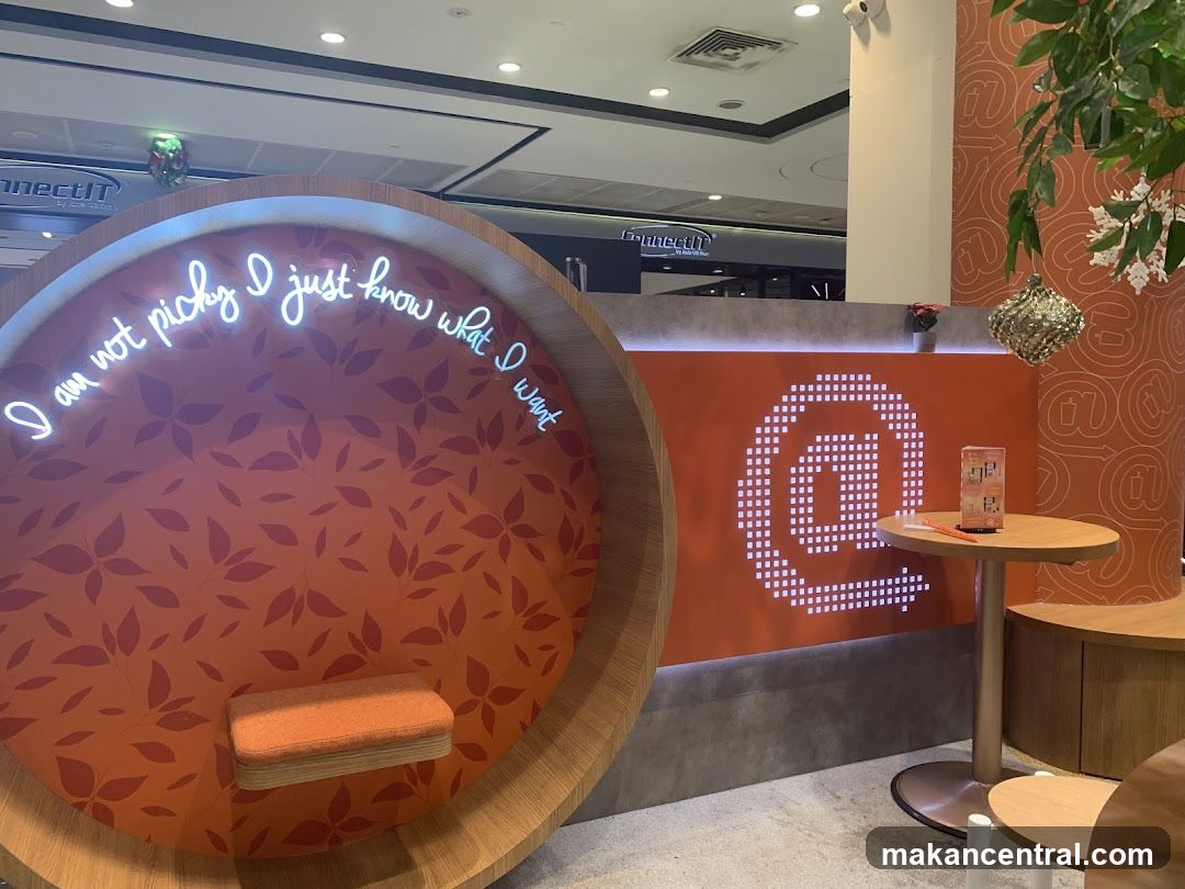 Interior seating area with neon sign