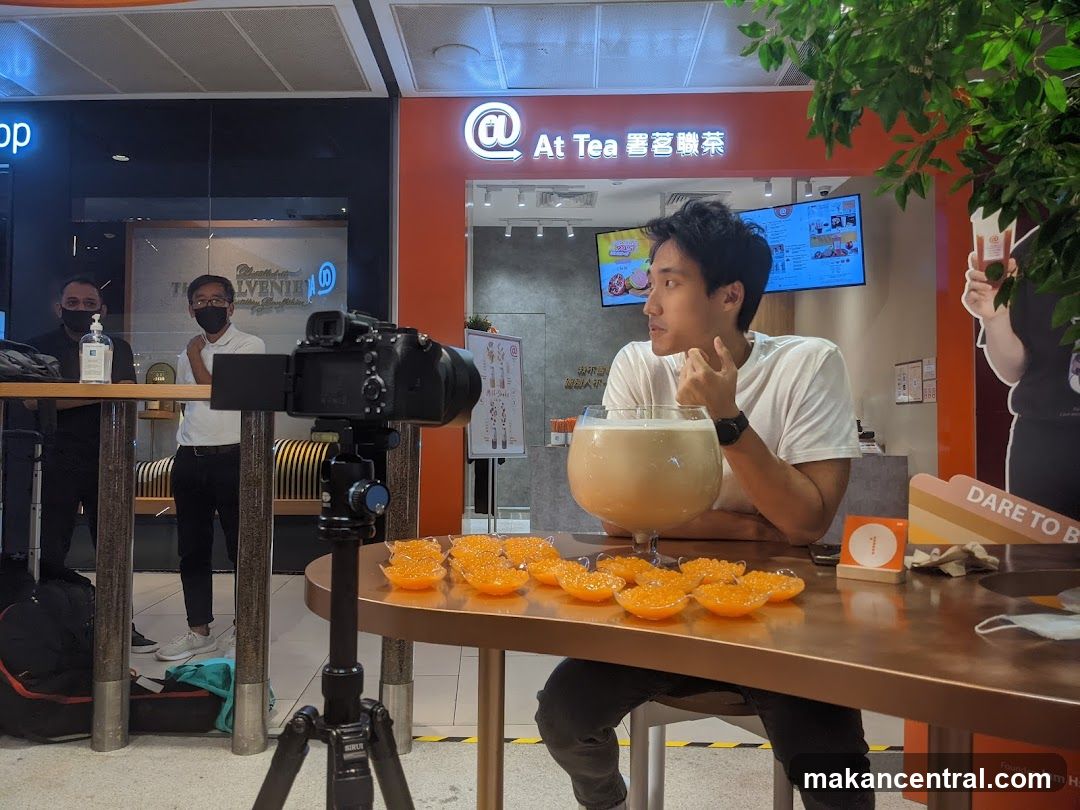 Man filming a large drink